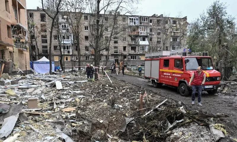 A resident looks at a crater that appeared at the site of an apartment building damaged during a Russian air strike, amid Russia’s attack on Ukraine, in Zaporizhzhia, Ukraine on October 17, 2026. — Reuters