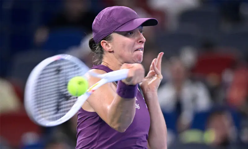 POLAND’S Iga Swiatek hits a return against compatriot Maja Chwalinska during their Wuhan Open semi-final at the Optics Valley International Tennis Centre on Saturday.—AFP POLAND’S Iga Swiatek hits a return against compatriot Maja Chwalinska during their Wuhan Open semi-final at the Optics Valley International Tennis Centre on Saturday.—AFP