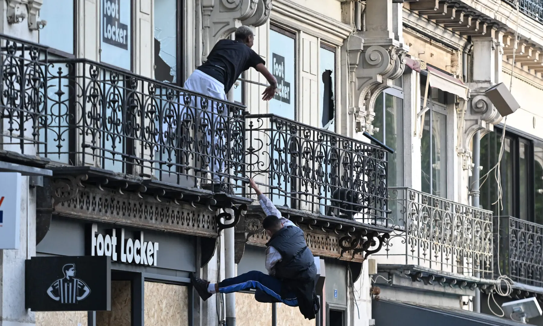  Protesters enter a Foot Locker store as they take part in a demonstration to protest against the &ldquo;high cost of living&rdquo;, in Nantes, western France, on Oct 17, 2026. &mdash; AFP 