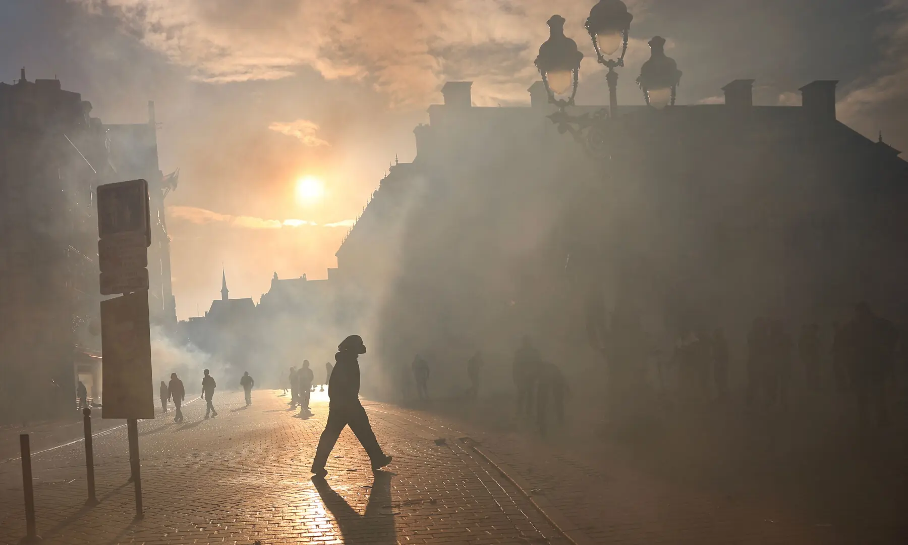  A protester walks in the smoke at Place de l&rsquo;Opera during ongoing protest action against the &ldquo;high cost of living&rdquo;, in Lille, northern France, on Oct 17, 2026. &mdash; AFP 