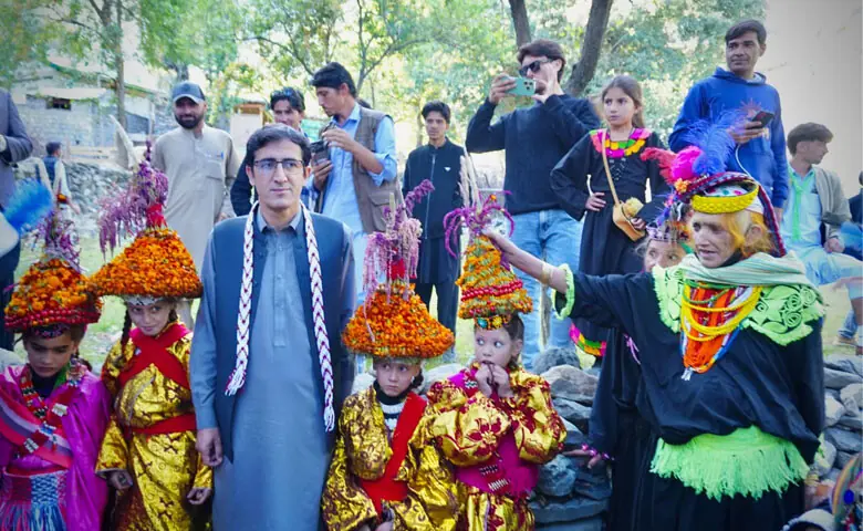 Kalash women and children in the dancing place of Bihal village in Birir valley. &mdash; Dawn