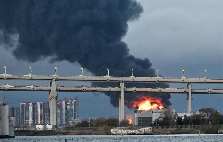 Smoke rises above Saint Petersburg following a Ukrainian drone attack on the city’s oil terminal.—AFP Smoke rises above Saint Petersburg following a Ukrainian drone attack on the city’s oil terminal.—AFP