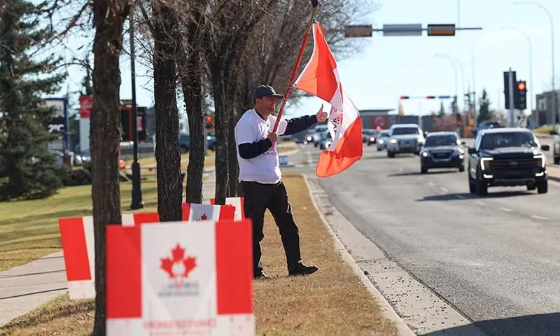 A supporter of the pro-Canada group Forever Canadian participates in an event, one day before the non-binding referendum on separation from Canada, in Okotoks, Alberta, Canada on October 18, 2026. — Reuters