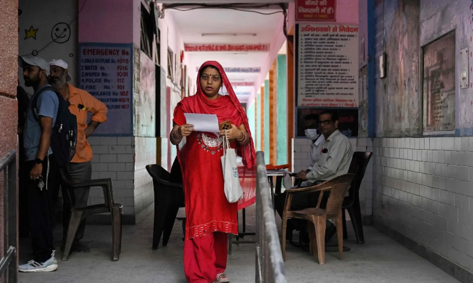 A woman leaves after submitting documents to register for the Draft Electoral Roll 2026 as part of the Election Commission of India’s Special Intensive Revision (SIR), at a voter verification camp in New Delhi on October 18, 2026. —AFP