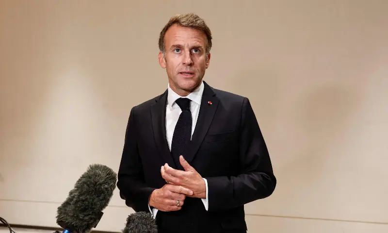 France's President Emmanuel Macron speaks to members of the media on the day of the 9th Annual One Planet Sovereign Wealth Funds (OPSWF) Summit in Lusail, Qatar on October 21, 2026. &mdash; AFP
