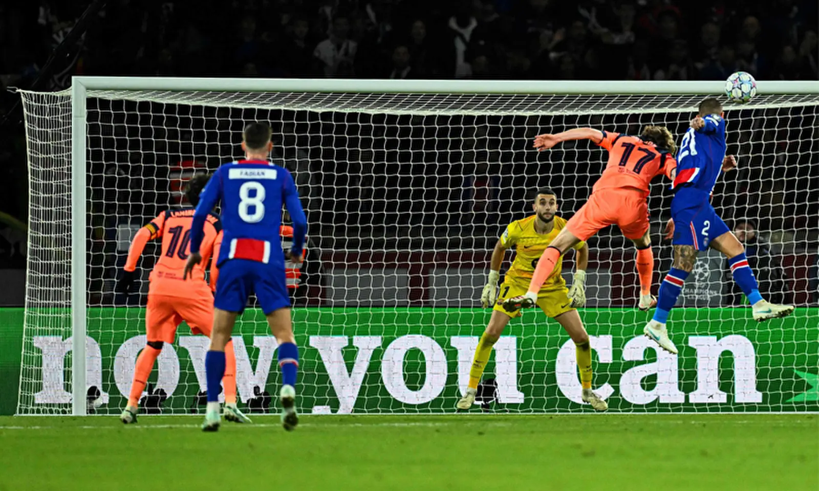 PARIS: PSG&rsquo;s Lucas Hernandez (R) heads to score past Barcelona goalkeeper Joan Garcia during their Champions League first-round match at the Parc des Princes Stadium.&mdash;AFP