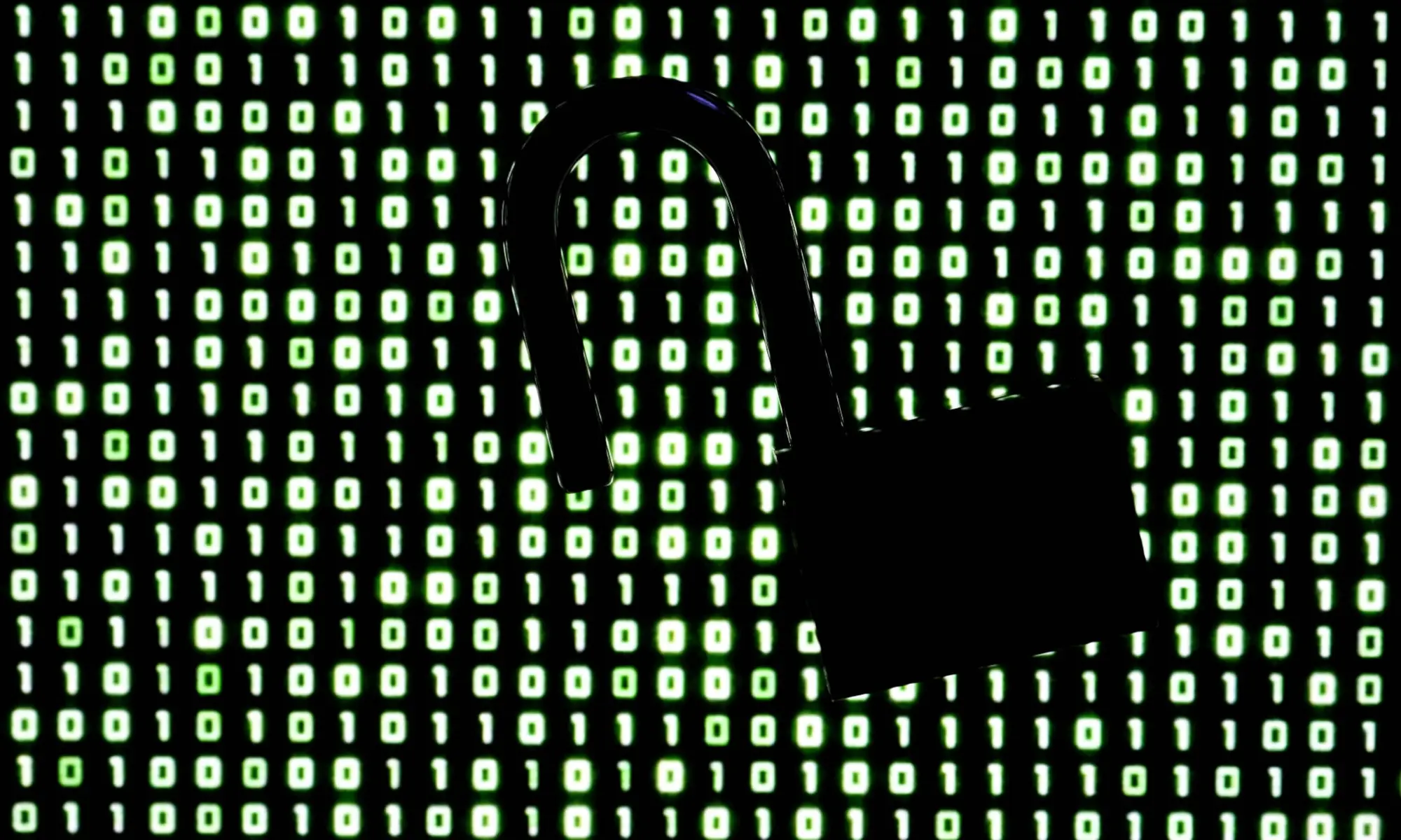 An illustration picture taken on October 21, 2026 shows a padlock in front of binary code on a laptop screen in Frankfurt am Main, western Germany. &mdash;AFP