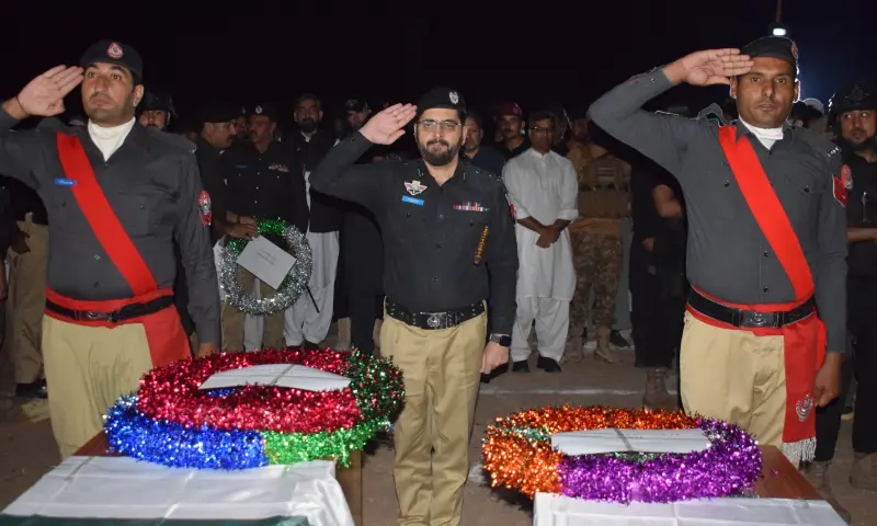 Police officers pay tribute to the martyred police personnel during funeral prayers in KP’s Karak on Oct 22. — photo courtesy KP police