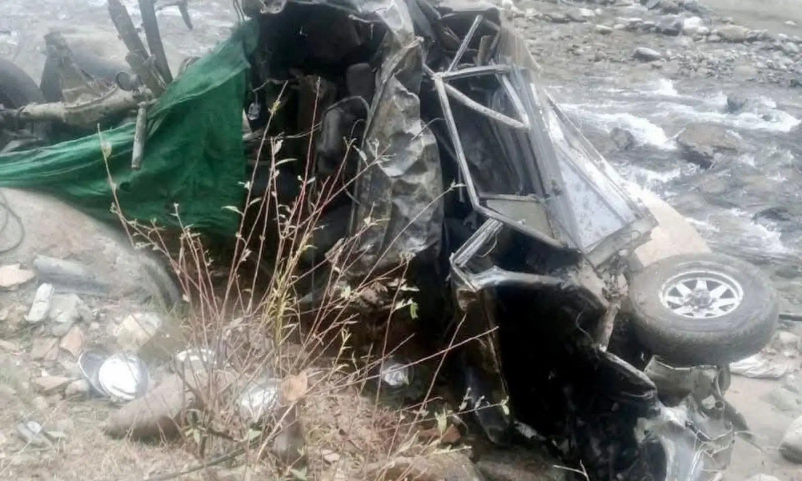 Van plunged into a ravine in the upper reaches of Neelum Valley on Saturday. Oct 24. --Photo provided by author Van plunged into a ravine in the upper reaches of Neelum Valley on Saturday. Oct 24. --Photo provided by author