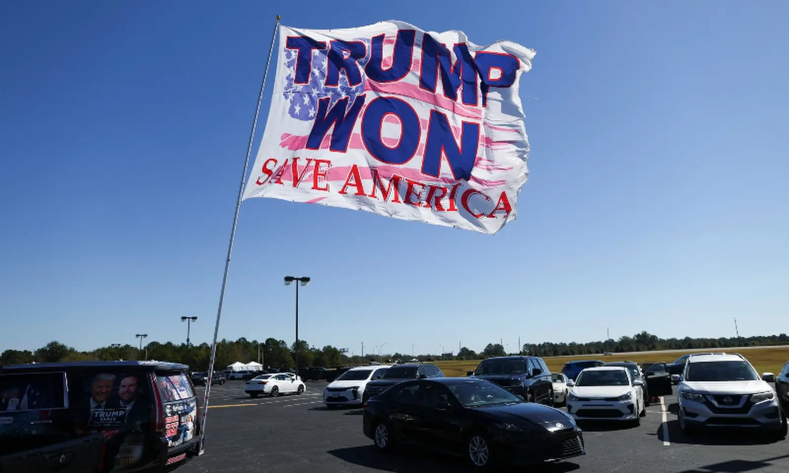 A flag supporting US President Donald Trump outside the venue of his rally ahead of the midterm elections, in Macon, Georgia, the US on Oct 24, 2026. &mdash; Reuters