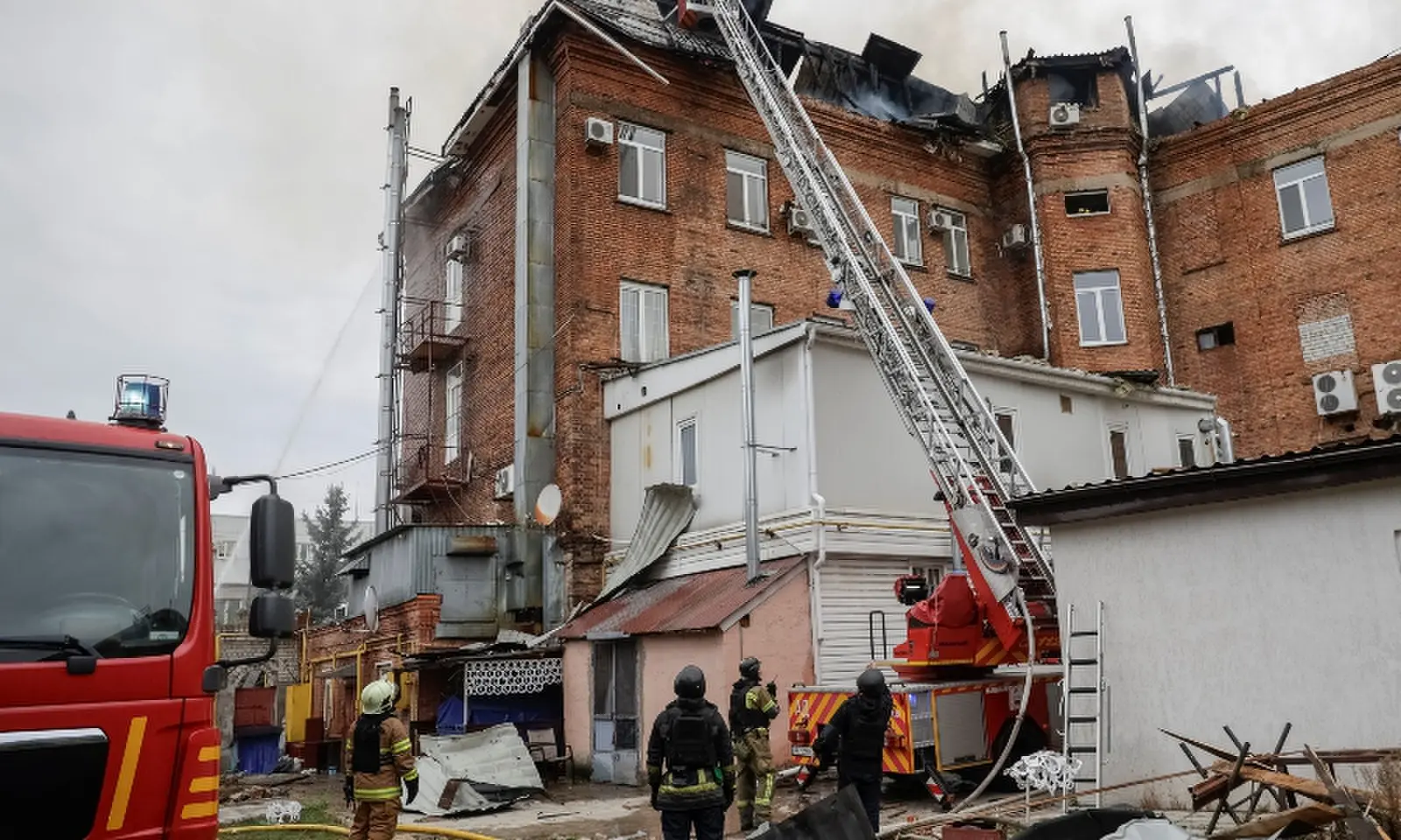 Firefighters work at the site of an office building damaged during a Russian jet drone strike in Kharkiv, Ukraine on Oct 23, 2026. &mdash; Reuters