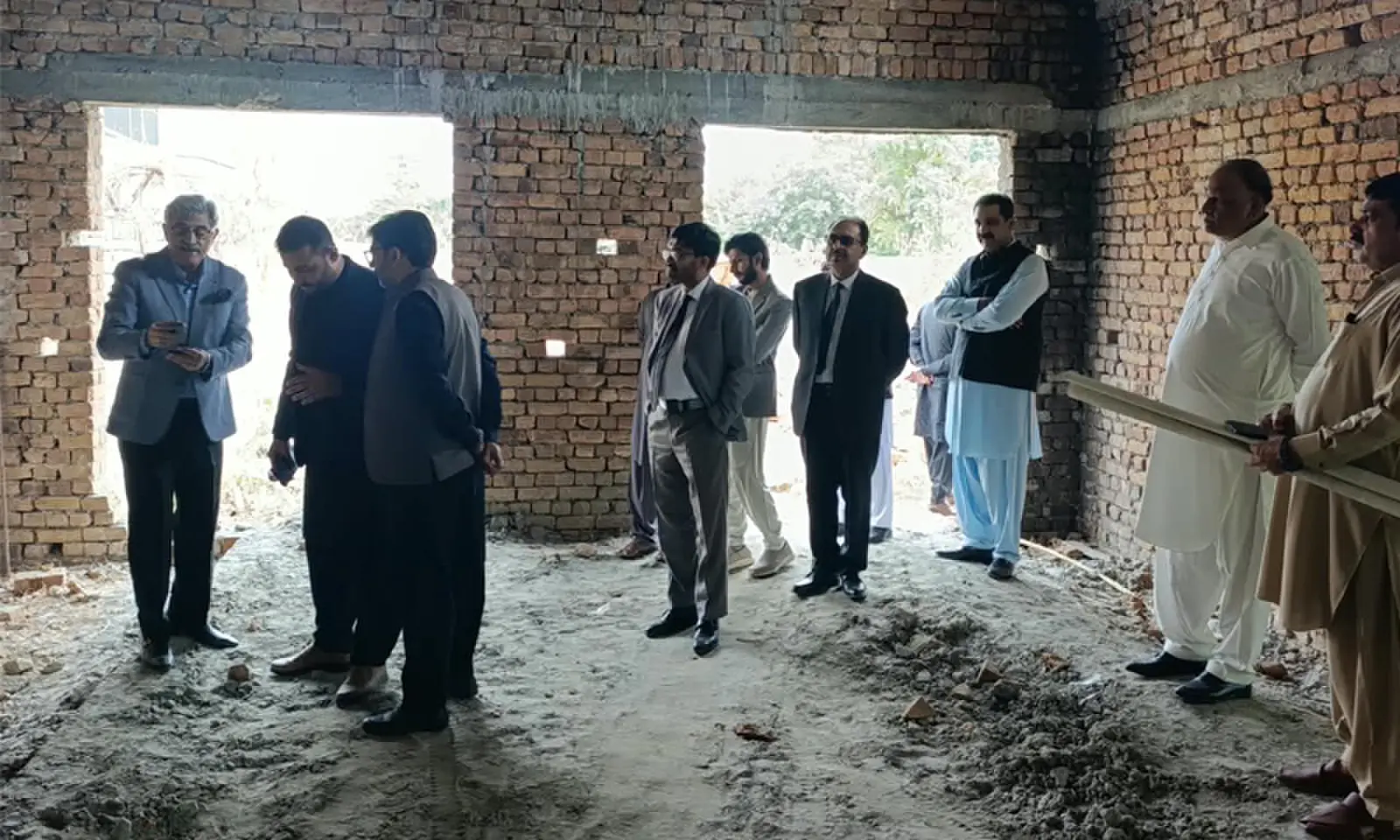 The recently raised structure vanished on arrival of inspection team to the site inside Civil Club Chakwal. The other picture taken on Oct 15 shows construction work is being carried out on the premises of the club. &mdash; Dawn