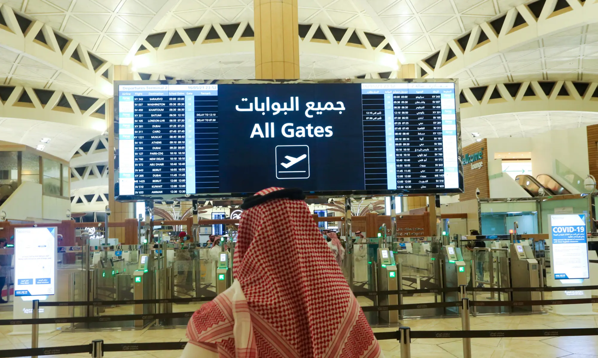 A Saudi man checks the flight timings at the King Khalid International Airport in Riyadh, Saudi Arabia, on May 16, 2021. &mdash; Reuters/File