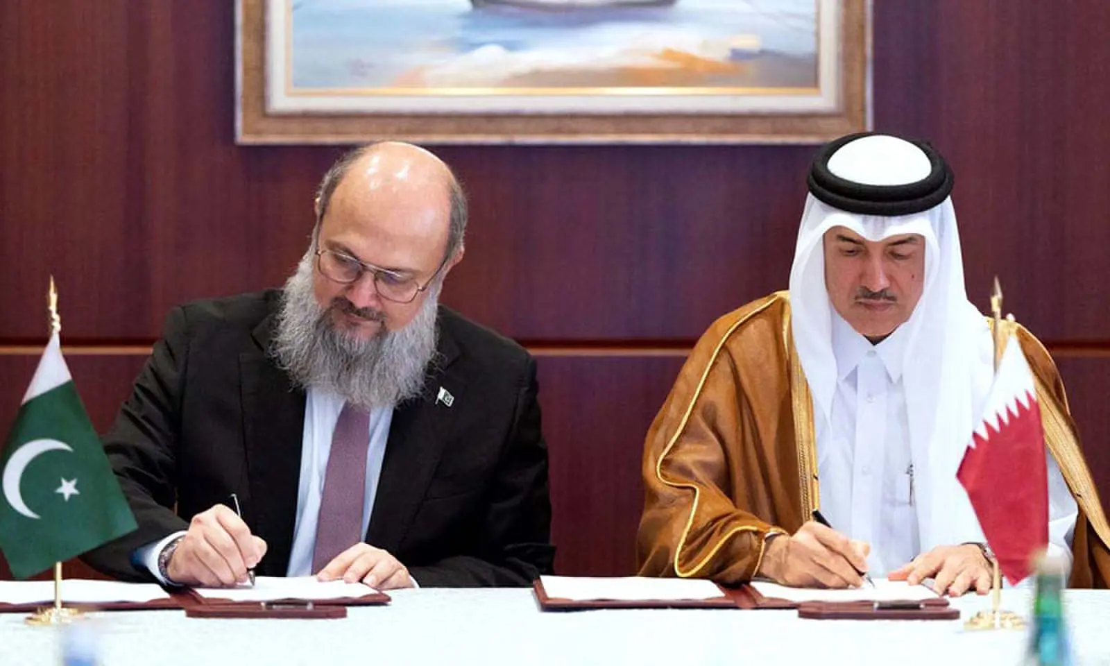 Commerce Minister Jam Kamal Khan and Qatari State Minister for Foreign Trade Affairs Dr Ahmad bin Mohammed Al-Sayed sign minutes of the joint task force on trade and investment meeting.—APP Commerce Minister Jam Kamal Khan and Qatari State Minister for Foreign Trade Affairs Dr Ahmad bin Mohammed Al-Sayed sign minutes of the joint task force on trade and investment meeting.—APP