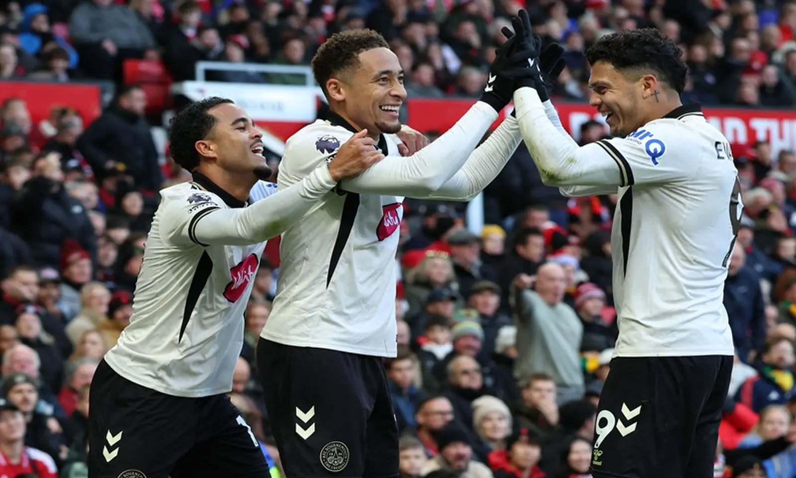 Bournemouth's Marcus Tavernier (C) celebrates with team-mates after scoring against Manchester United during their English Premier League match at Old Trafford in Manchester on October 25, 2026. &mdash;AFP