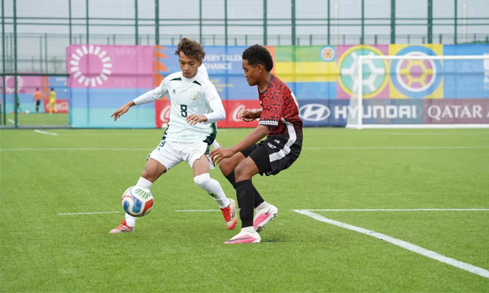 PLAYERS in action during the FIFA U-15 World Cup match between Pakistan and Tonga on Wednesday. —Courtesy PFF PLAYERS in action during the FIFA U-15 World Cup match between Pakistan and Tonga on Wednesday. —Courtesy PFF