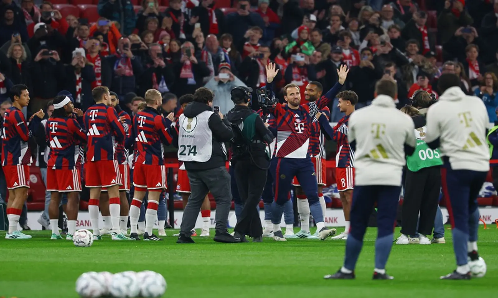 Bayern Munich's Harry Kane acknowledges fans as team-mates line up to celebrate his Ballon d'Or win before the German Cup second-round match at the Allianz Arena in Munich on October 28, 2026. —Reuters Bayern Munich's Harry Kane acknowledges fans as team-mates line up to celebrate his Ballon d'Or win before the German Cup second-round match at the Allianz Arena in Munich on October 28, 2026. —Reuters