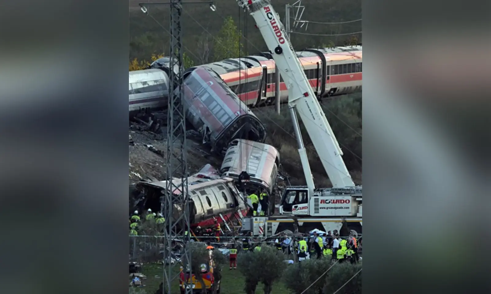 A crane removes debris as rescue workers look for survivors at the site of a crash between two high-speed trains in Toledo province, around 130km south of Madrid. The collision claimed at least 68 lives, and the toll is likely to rise in one of Europe’s deadliest such disasters this century. —AFP A crane removes debris as rescue workers look for survivors at the site of a crash between two high-speed trains in Toledo province, around 130km south of Madrid. The collision claimed at least 68 lives, and the toll is likely to rise in one of Europe’s deadliest such disasters this century. —AFP