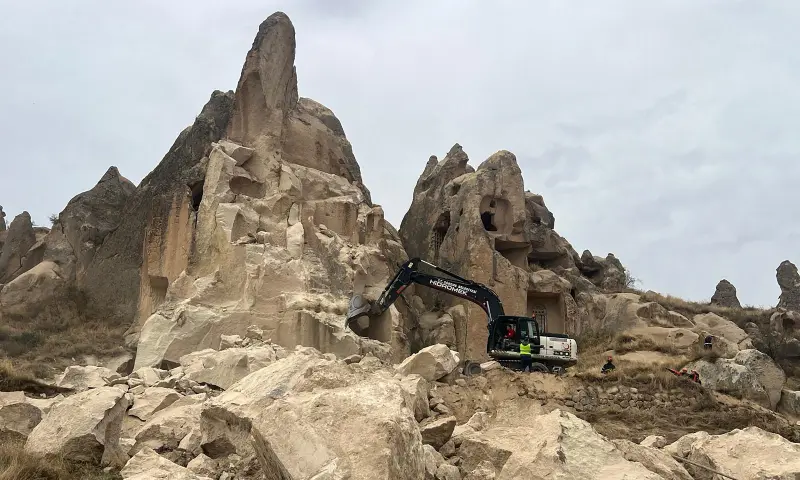 This handout photograph taken and released on October 29, 2026 by Turkish news agency DHA (Demiroren News Agency) shows rescue teams searching for victims at the site of a rock formation that collapsed due to a landslide triggered by heavy rains in Cappadocia district of Nevsehir. &mdash; AFP