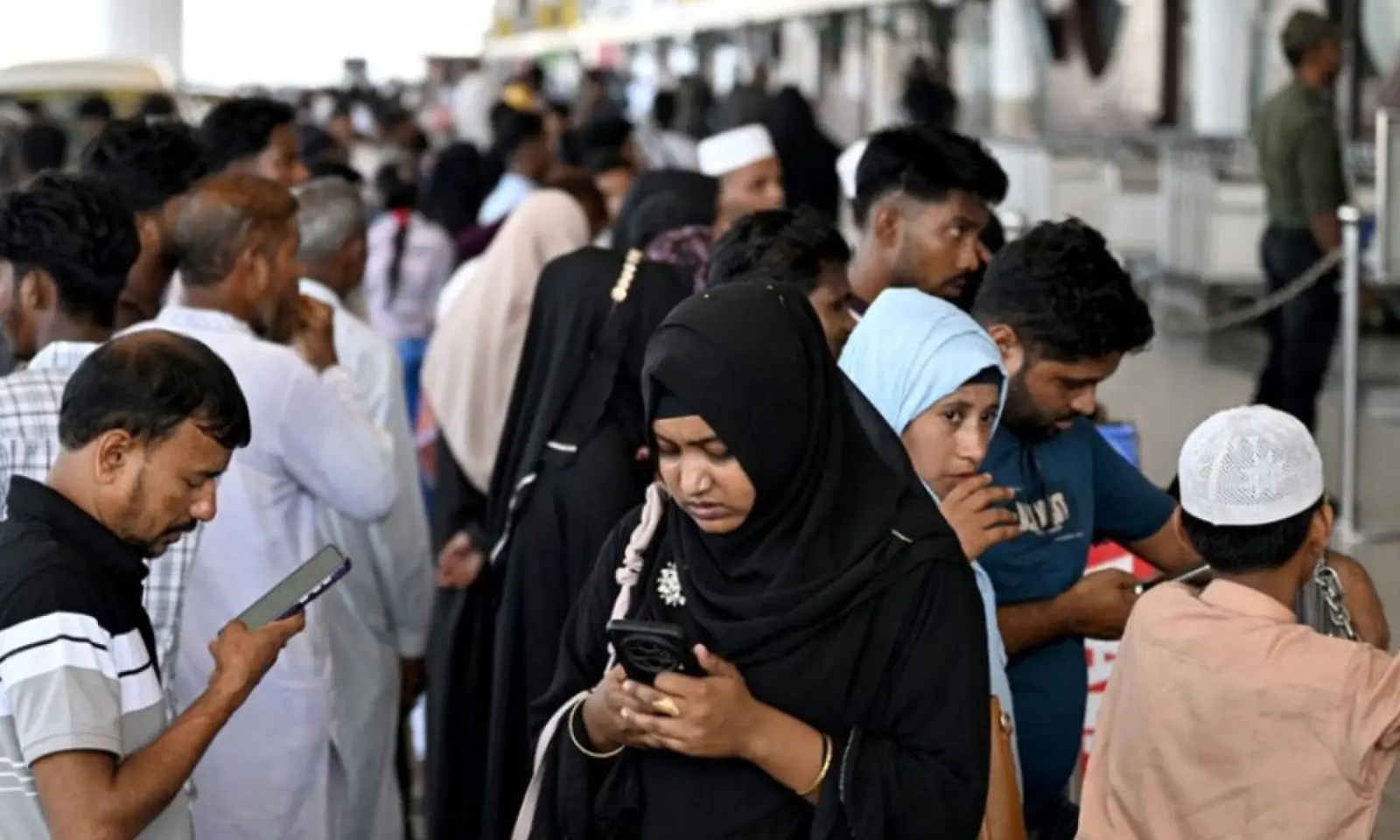 Saudi Arabia-bound passengers remain stranded at the Hazrat Shahjalal International Airport in Dhaka on October 12, 2026, after their flights were cancelled a day after a Houthi strike at Riyadh's international airport. &mdash;AFP/File