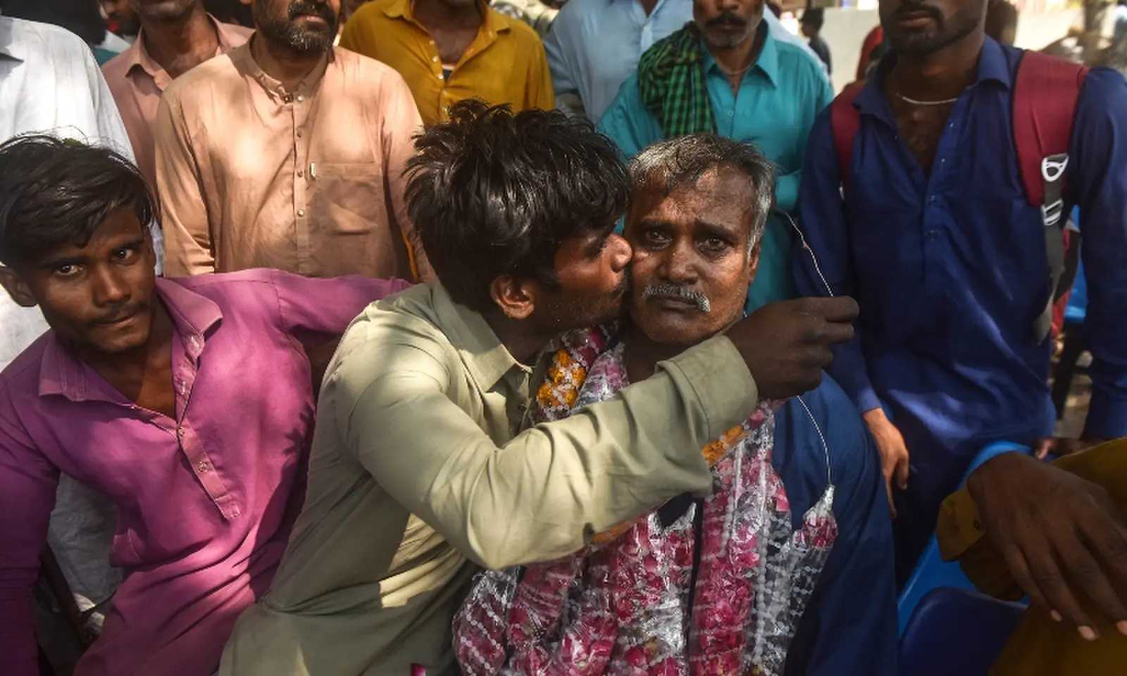 Pakistani fishermen reunite with families at Edhi Centre on October 30. — White Star/ Fahim Siddiqi