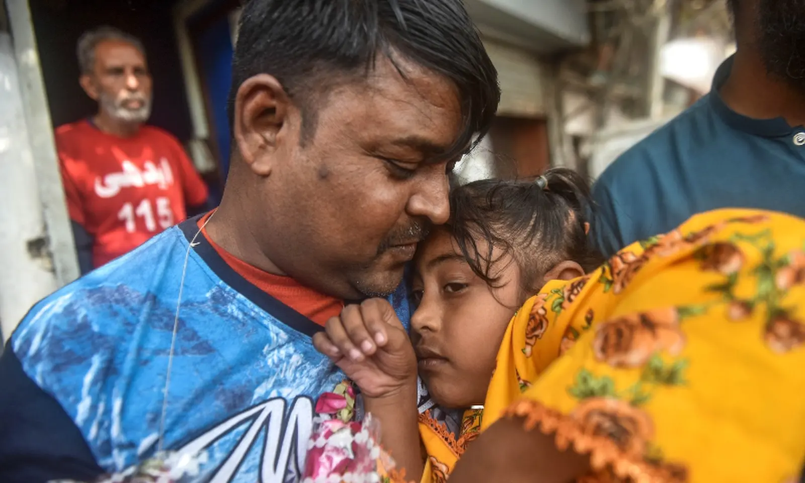 Pakistani fishermen reunite with families at Edhi Centre on October 30. — White Star/ Fahim Siddiqi