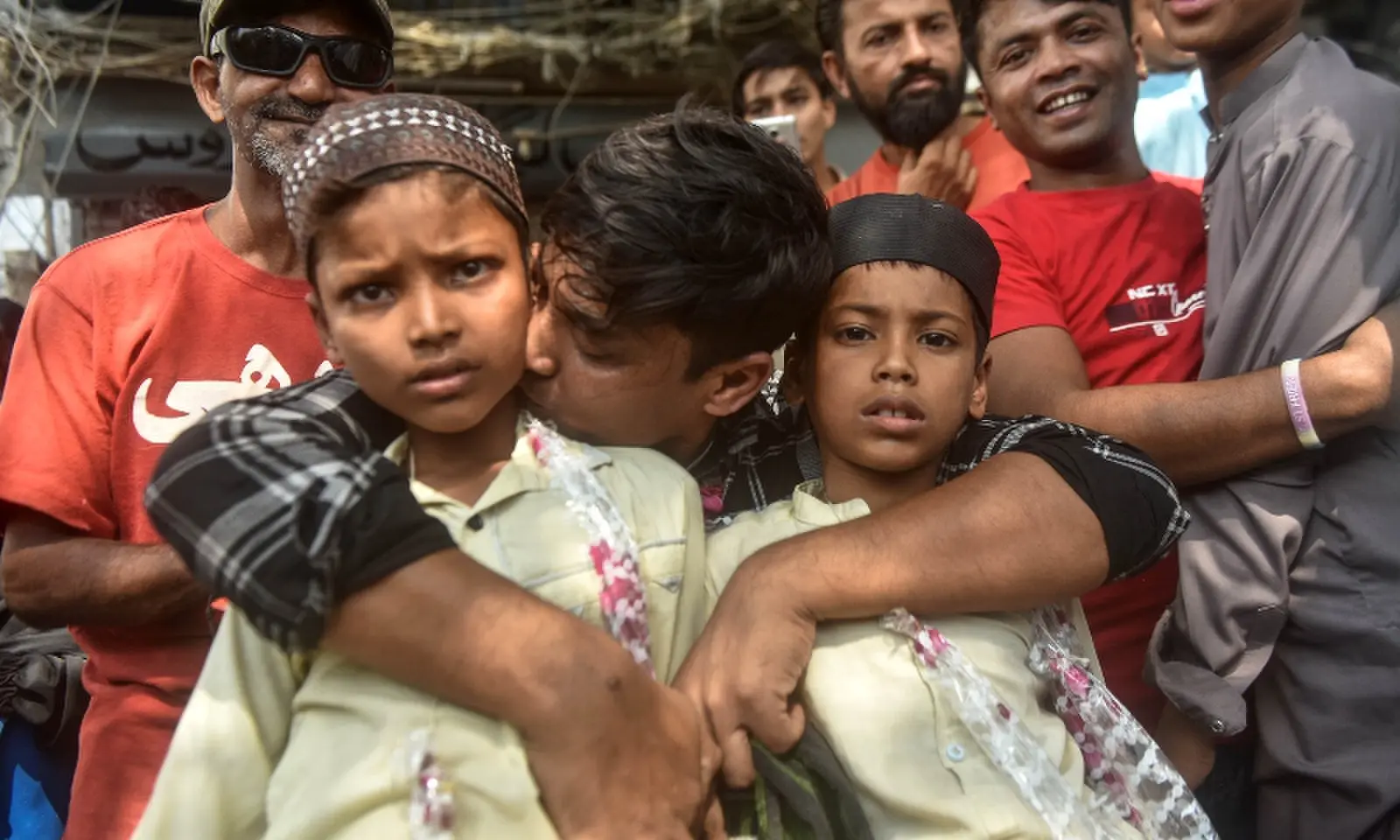 Pakistani fishermen reunite with families at Edhi Centre on October 30. — White Star/ Fahim Siddiqi