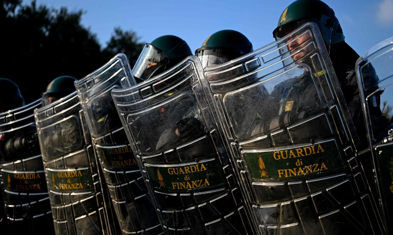 Guardia di Finanza officers operate during a demonstration part of a nationwide day of strikes and protests as school and university students demand more funding for schools and support for housing, in Milan, northern Italy on October 30, 2026. — AFP
