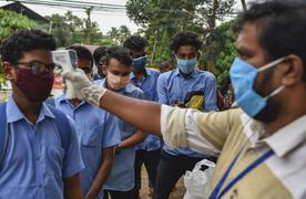 WHO warns that 1st wave of pandemic not over, dampens hopes