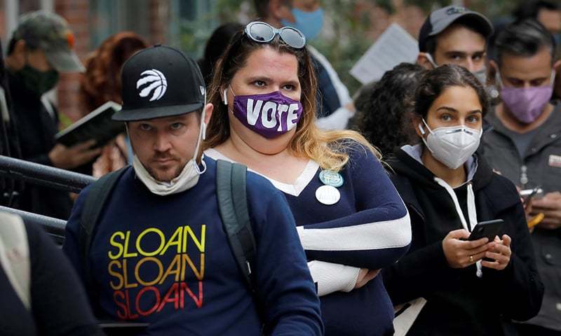 US sets record for cases amid election battle over coronavirus