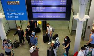 Britain considers vaccine passports to restart international travel