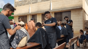 A group of friends brought joy to 250 kids at a Karachi flood relief camp by getting them haircuts