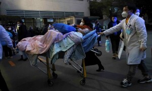 Chinese hospitals &lsquo;extremely busy&rsquo; as Covid spreads unchecked