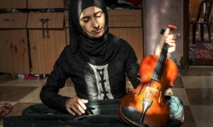 Palestinian teacher sings to &lsquo;block out&rsquo; roar of Israel strikes
