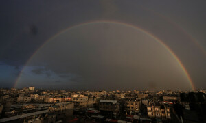 PHOTOS: Lightning illuminates smoke in Gaza night sky as rainbow appears the next morning