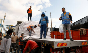 PHOTOS: UN agency distributes flour bags to languished Palestinians in southern Gaza