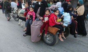 PHOTOS: Displaced Palestinians return home as temporary truce between Hamas, Israel kicks in