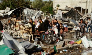 In pictures: Gazans fill streets heading home on 1st day of temporary truce