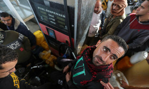 PHOTOS: Truce provides momentary relief as Palestinians line up for fuel