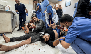 Gaza hospital swamped with wounded Palestinians as Hamas reports intense clashes