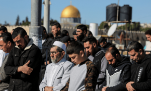 PHOTOS: Palestinians hold Friday prayers in front of Al-Aqsa Mosque