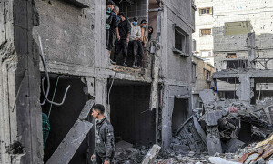 PHOTOS: People inspect rubble of building destroyed by Israeli bombardment in southern Gaza