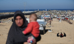 PHOTOS: Beleaguered Palestinians seek refuge following Israeli strikes
