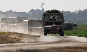 PHOTOS: Israeli military vehicles patrol near the Israel-Gaza border
