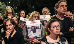 Hamas calls for end of bombing, shows video of 3 captives