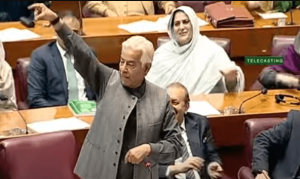 Khawaja Asif waves wristwatch in response to commotion by PTI-backed MNAs