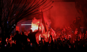 Jordanian anti-riot police use batons to push back protesters near Israeli embassy