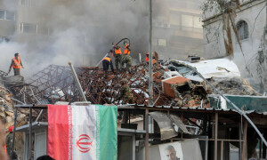 PHOTOS: Workers search rubble after Israeli strike on Iran consulate in Syria