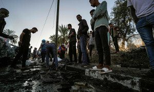 PHOTOS: Palestinians inspect the site of an Israeli strike in the Central Gaza Strip
