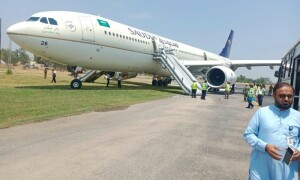 Saudi airliner’s landing gear catches fire during touchdown at Peshawar airport Saudi airliner’s landing gear catches fire during touchdown at Peshawar airport